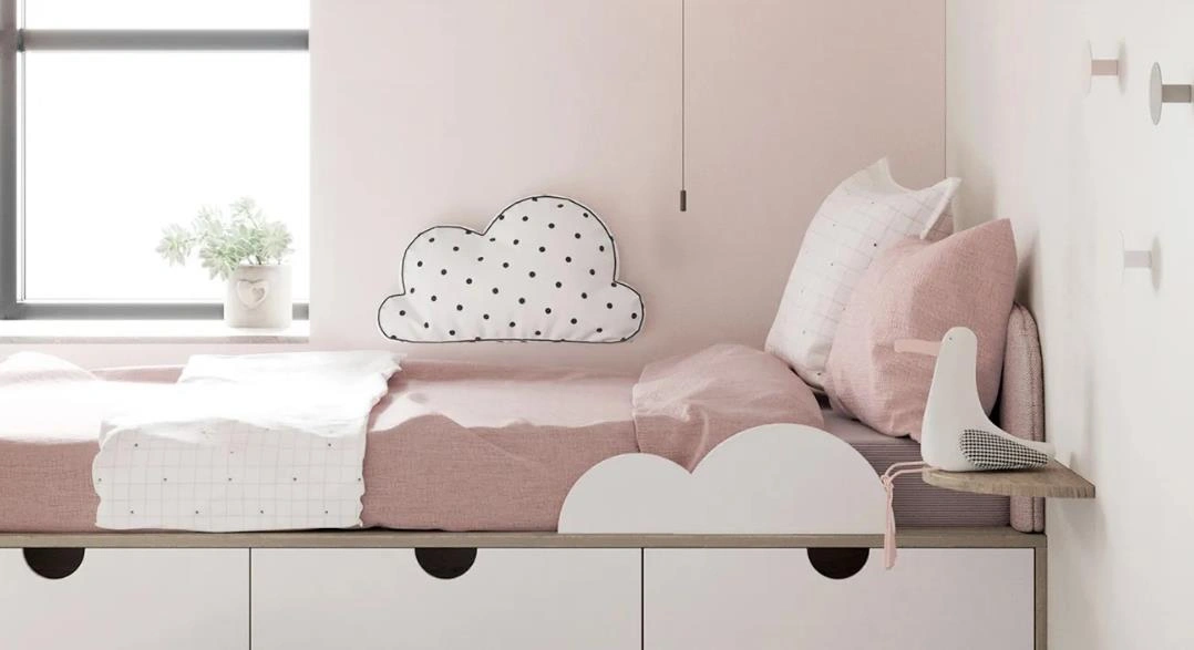 Storage drawers under a child’s bed.