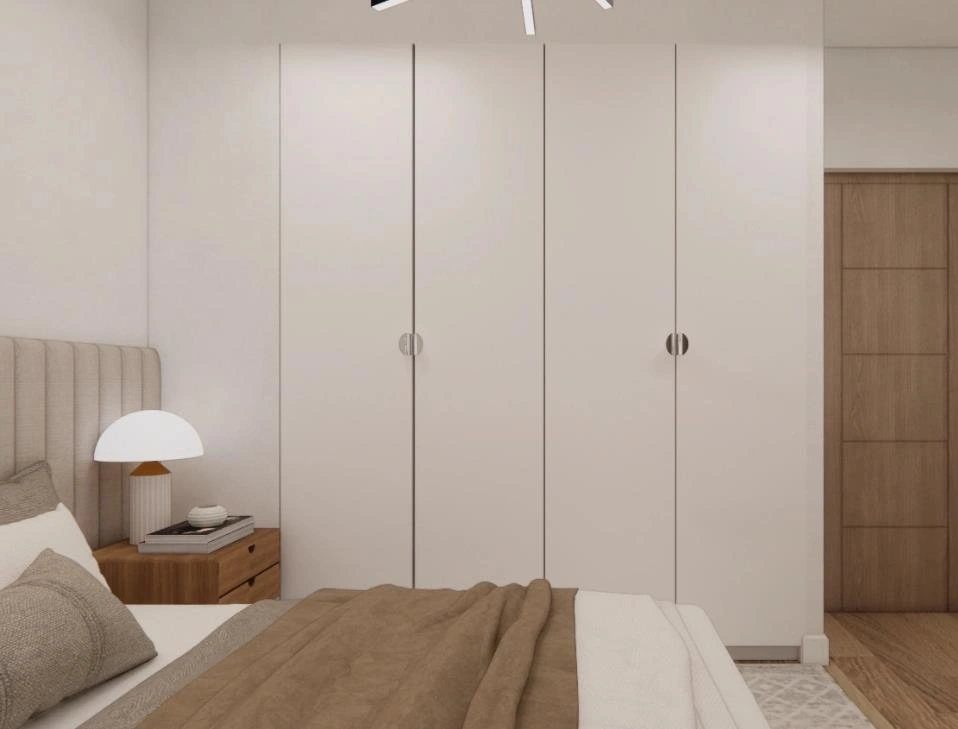 Wall-mounted white storage cabinets, maximizing space in small apartment for books and daily items.