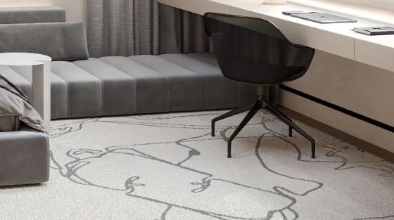 Large light-gray carpet covering a teen’s bedroom floor.