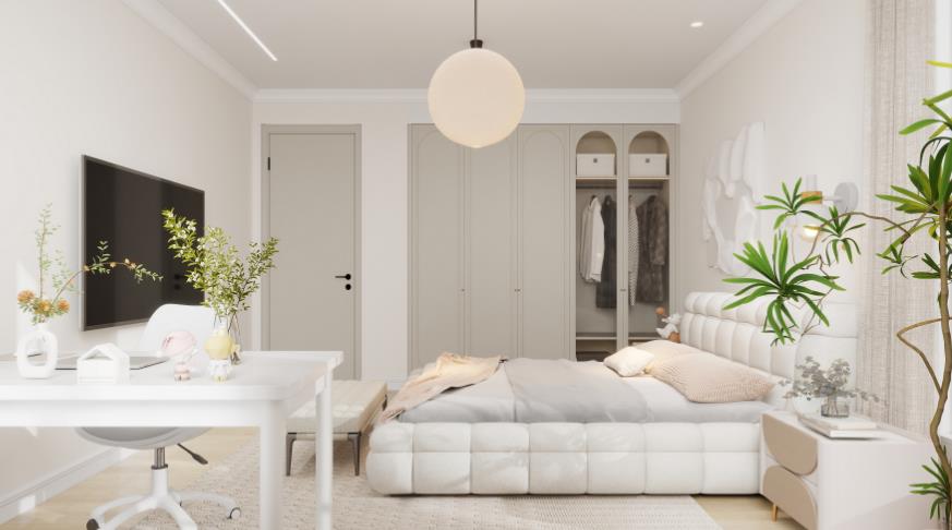 A warm cream bedroom with an upholstered headboard and a tidy study nook