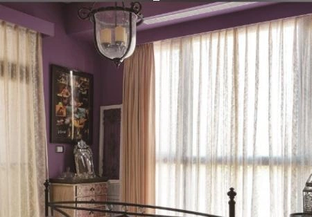 A vintage-style glass chandelier hangs from the ceiling